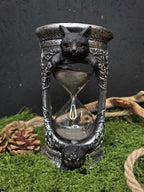 Tiimalasi, kissa aiheinen.