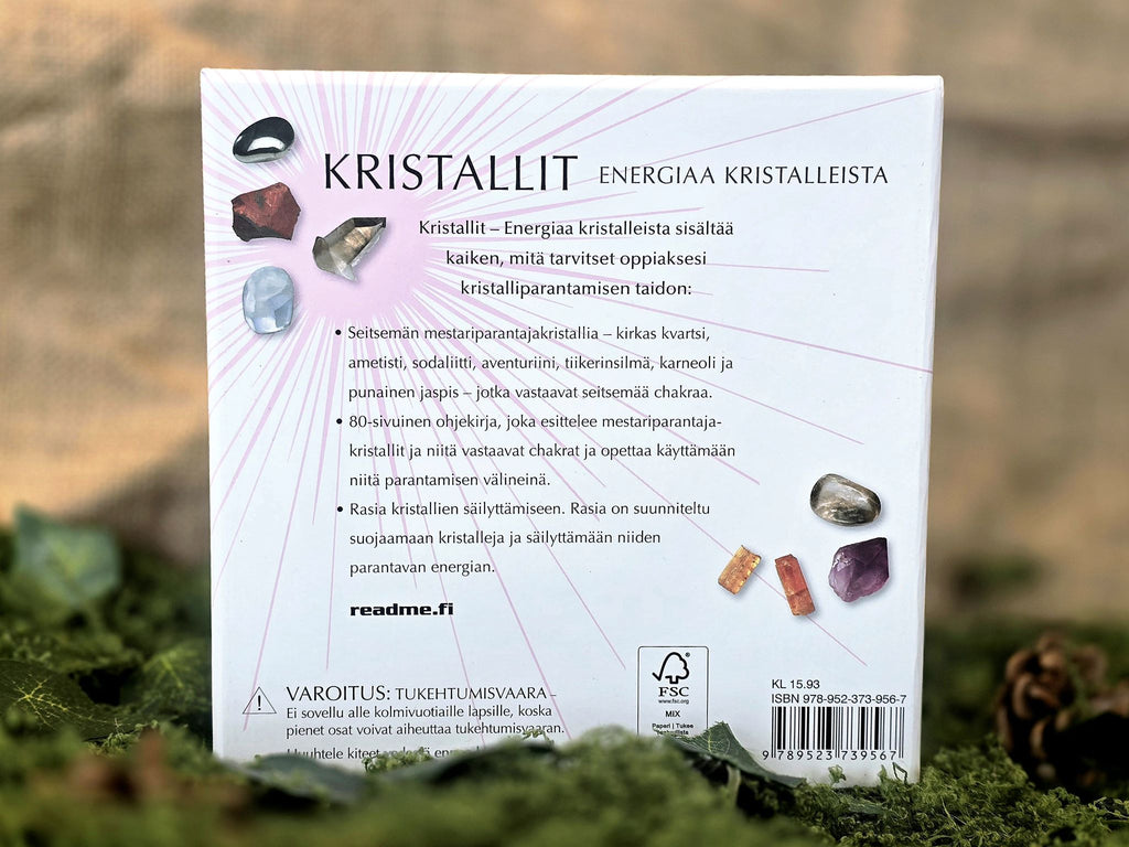 Kristalli, energiaa kristalleista, erilaisia kiviä ja oppaan sisältävä pakkaus. 