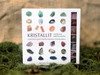 Kristalli, energiaa kristalleista, erilaisia kiviä ja oppaan sisältävä pakkaus. 